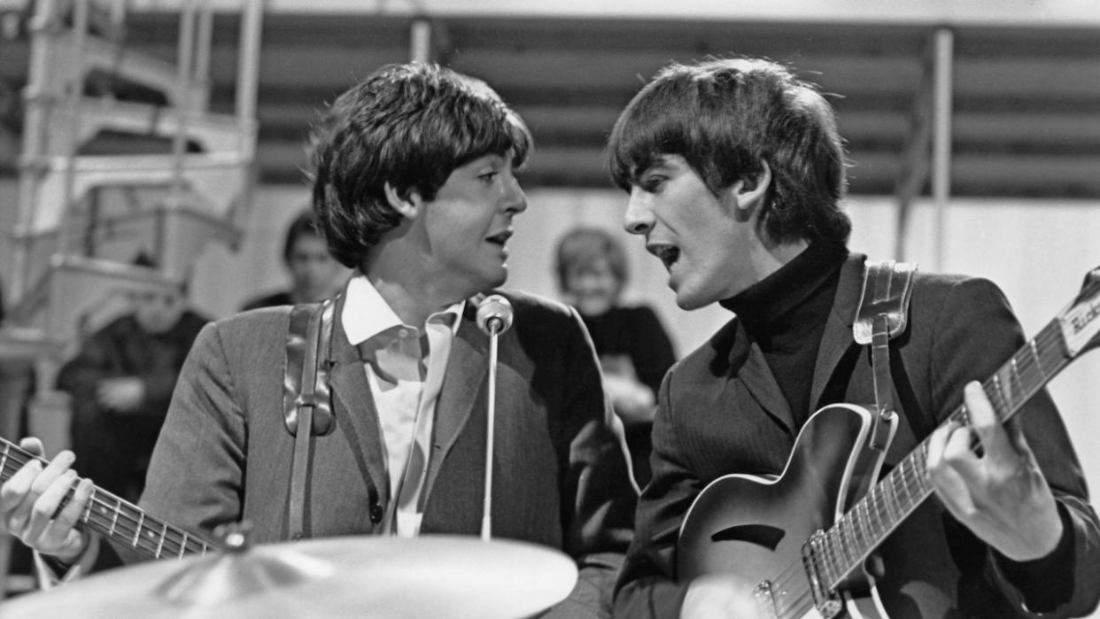  Paul McCartney (left) and George Harrison (1943-2001) from The Beatles perform on The 'Around The Beatles' TV special at Rediffusion's Wembley Studio in London on 28th April 1964. 