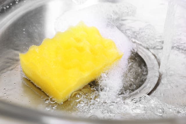 Water flowing down hole in kitchen sink