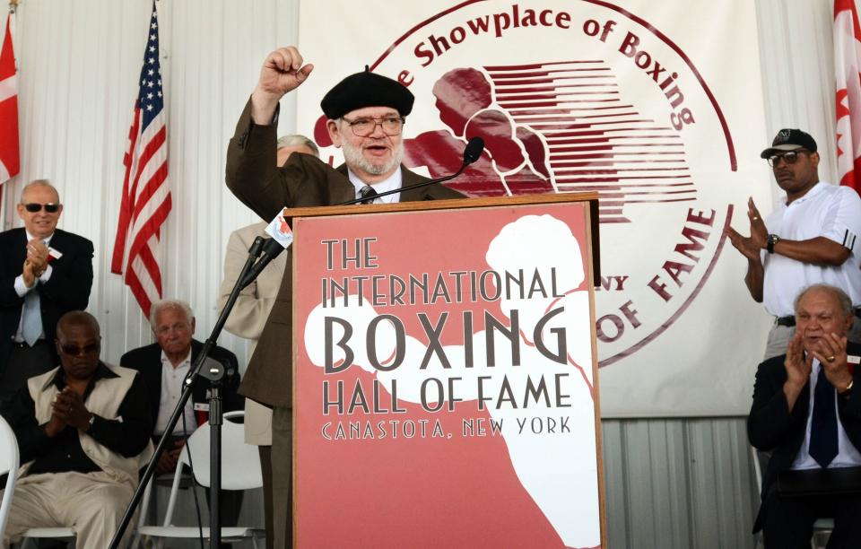 CORRECTS TO CANASTOTA NOT CANASOTA - International Boxing Hall of Fame inductee and boxing analyst Michael Katz, pumps his fist after giving his speech during the induction ceremony in Canastota, N.Y., Sunday, June 10, 2012. (AP photo/Heather Ainsworth)