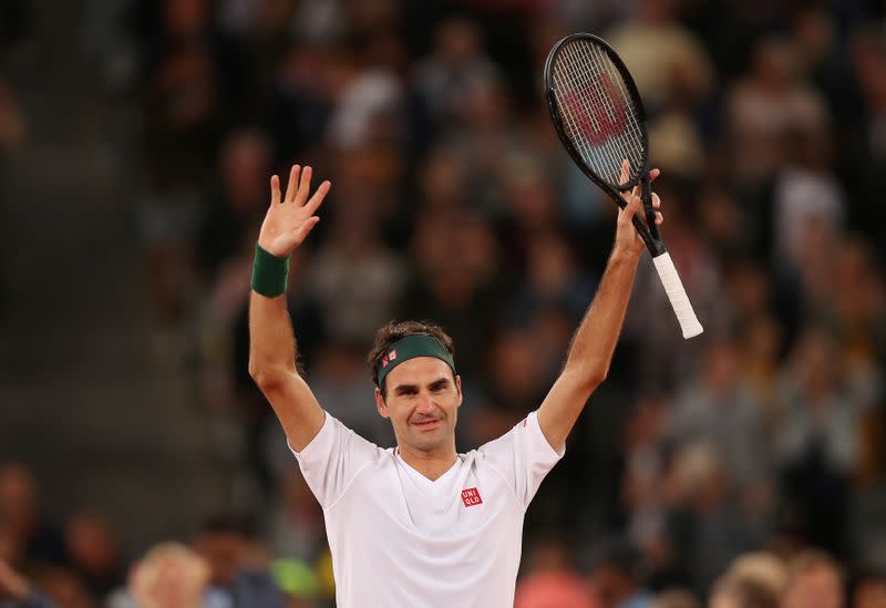 FILE PHOTO: Roger Federer celebrates after winning an exhibition match against Spain's Rafael Nadal