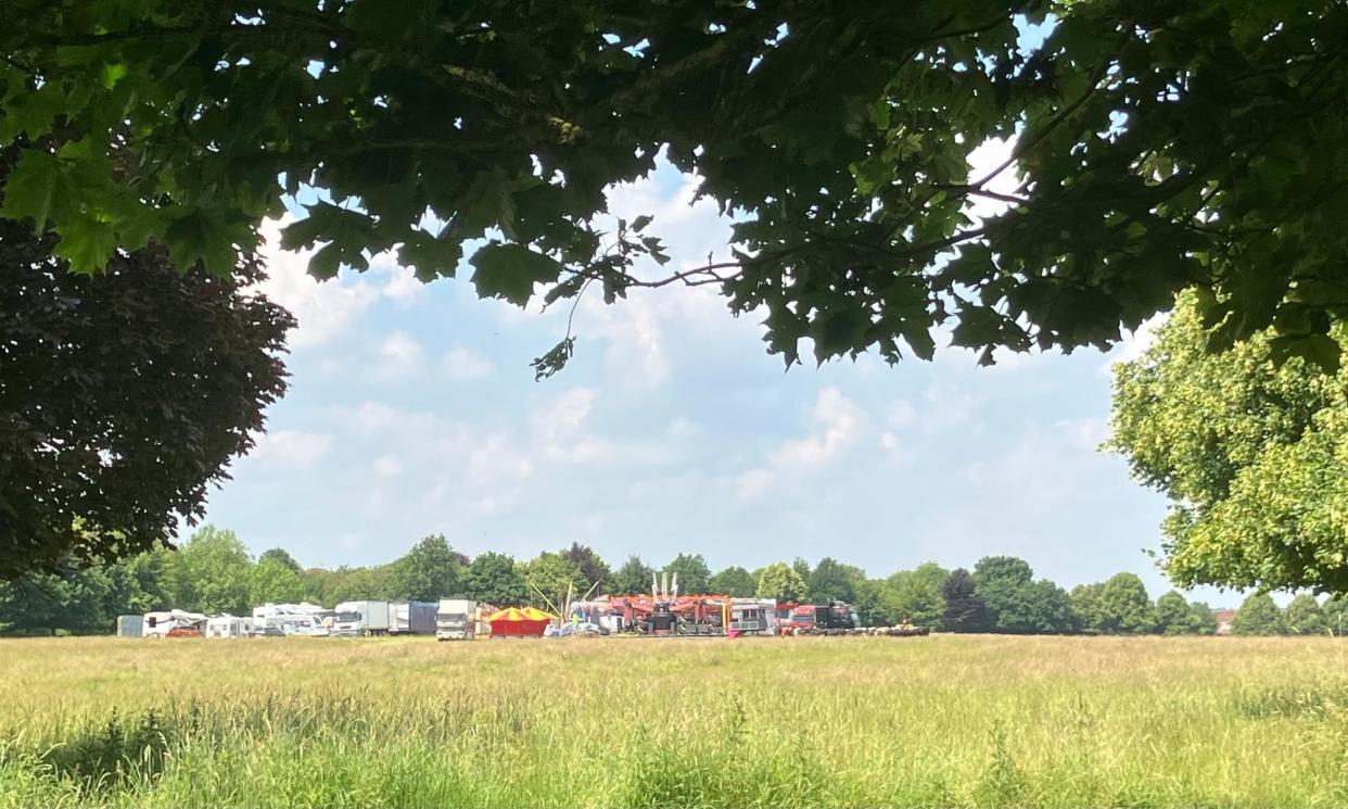 <span>‘A golden-mauve haze of grass pollen underscores an intriguing tableaux: the fair has pitched up, and the cows have formed a jostling queue around it.’</span><span>Photograph: Nicola Chester</span>