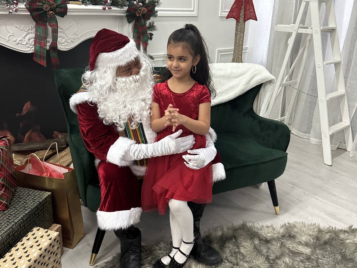 Meiz Majdoub is dressed as Santa Claus for the Black Santa Experience at Lenz Studio in Nepean on Dec. 3, 2022. (Michelle Allan/CBC News - image credit)