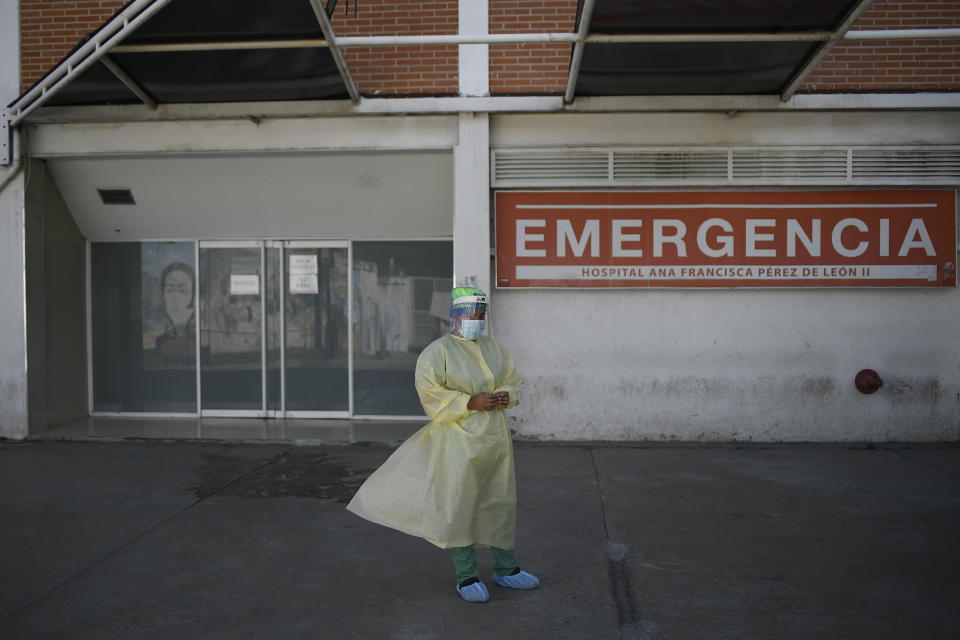 A doctor waits to get a shot of the Sputnik V vaccine for COVID-19 at the Pérez de Leon II public hospital in Caracas, Venezuela, Friday, Feb. 19, 2021. (AP Photo/Matias Delacroix)