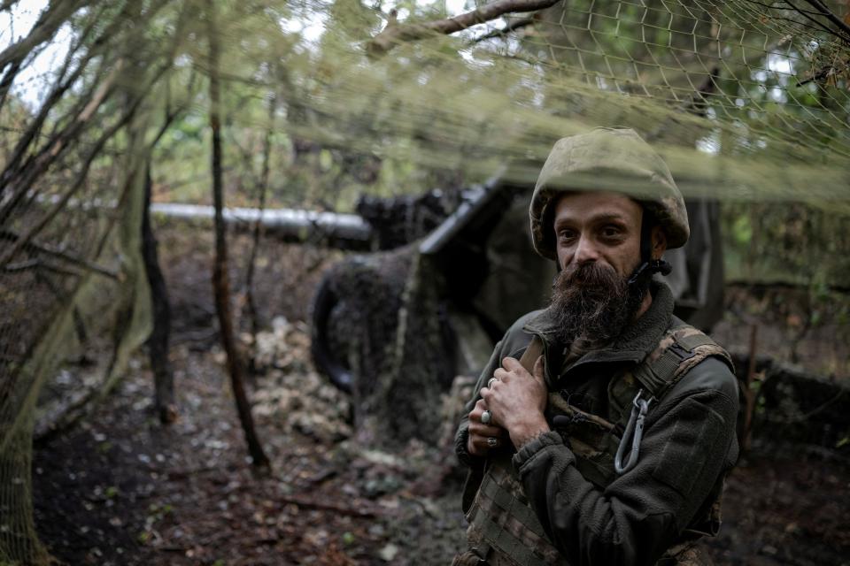 An artilleryman of the 13th Operative Purpose Brigade 'Khartiia' of the National Guard of Ukraine waits to fire towards Russian troops (REUTERS)