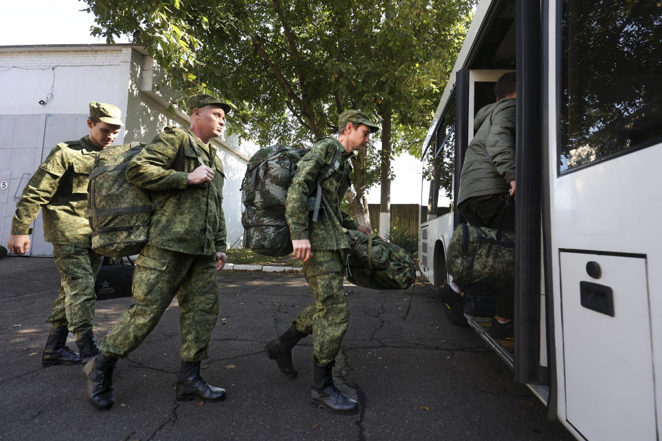 FILE - Russian recruits take a bus near a military recruitment center in Krasnodar, Russia, Sunday, Sept. 25, 2022. Russian President Vladimir Putin on Wednesday ordered a partial mobilization of reservists to beef up his forces in Ukraine. (AP Photo, File)