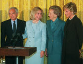 FILE - In this Sept. 24, 1996 file photo, First lady Hillary Rodham Clinton, second from left, hosts, from left, designer Ralph Lauren, Katharine Graham, chairman of the board, The Washington Post Company, and Princess Diana during a breakfast at the White House in recognition of the Nina Hyde Center for Breast Cancer Research. (AP Photo/Wilfredo Lee, File)