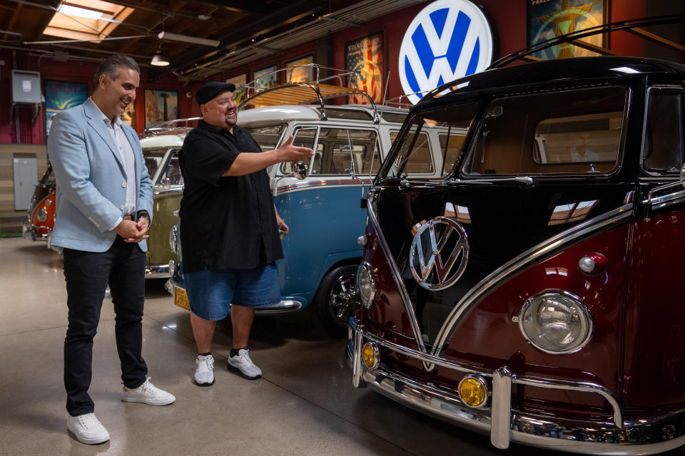 Pablo Di Si, Volkswagen Group of America's president and CEO (left), pays comedian Gabriel Iglesias and his VW collection a visit.