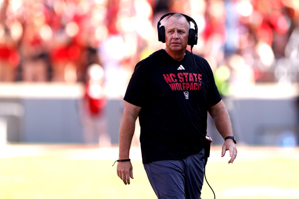 RALEIGH, NORTH CAROLINA - OCTOBER 28: Head coach Dave Doeren of the NC State Wolfpack looks on during the first half of the game against the Clemson Tigers at Carter-Finley Stadium on October 28, 2023 in Raleigh, North Carolina. (Photo by Lance King/Getty Images)