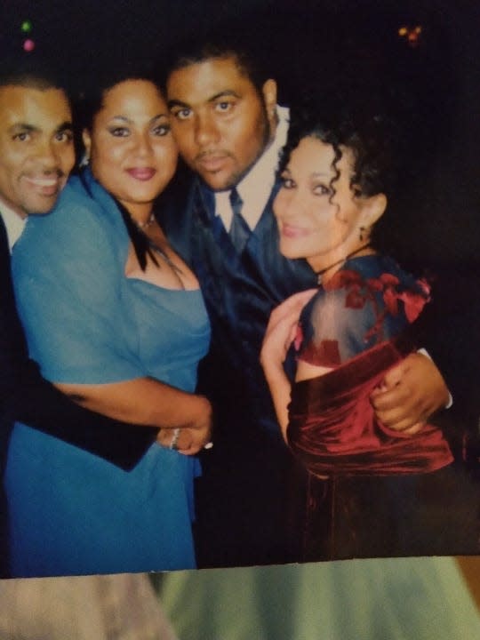 A photo of Omar Wesley (second to right) at his brother's wedding in 2006.