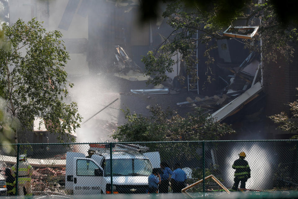 <p>Emergency personnel put water on the scene of school building explosion and collapse at Minnehaha Academy in Minneapolis, Minnesota, August 2, 2017. (Adam Bettcher/Reuters) </p>