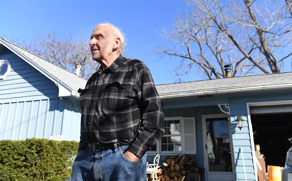 Les Nicol, 80, talks Saturday in front his Edgemere Drive home in the small town of Greece, New York. He said he doesn't recall seeing a total solar eclipse in his life but hopes to catch the one passing above parts of New York on April 8, 2024.