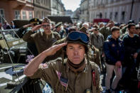 <p>History enthusiasts dressed in WWII U.S. Army uniforms salute as the national anthem of the United States plays during the “Convoy of Liberty” event on April 29, 2016, in Prague, Czech Republic. The “Convoy of Liberty'”commemorates the 71st anniversary of the liberation of the western part of the Czech Republic by the U.S. Army from Nazi oppression in 1945. The convoy’s route begins on the bank of Vltava river in Prague and makes its first stop in front of the U.S. embassy, where it will be met by the Czech Army Military Band.<i> (Matej Divizna/Getty Images)</i></p>