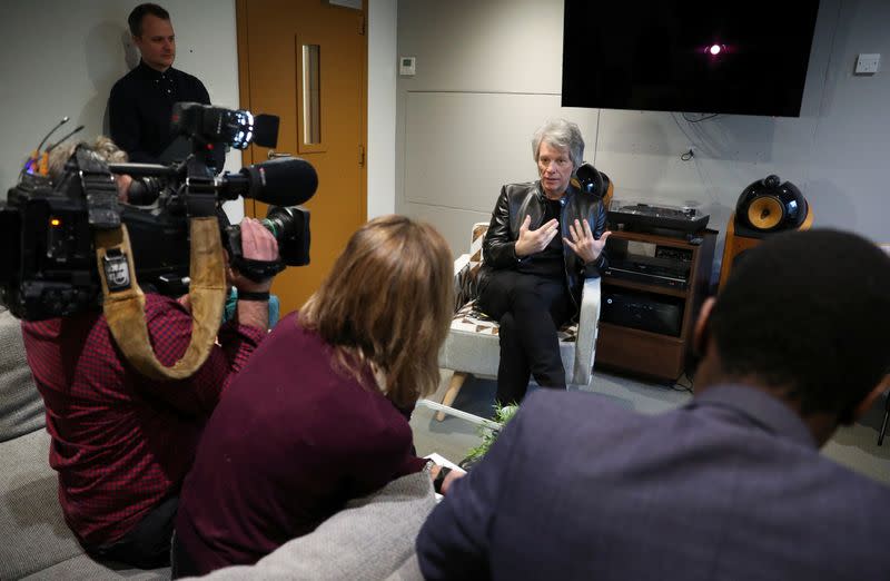 Jon Bon Jovi speaks to the media before a meeting with Britain's Prince Harry at Abbey Road Studios in London