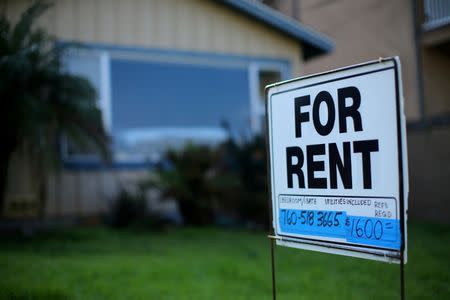 FILE PHOTO - A "For Rent" sign is posted outside a residential home in Carlsbad, California, U.S. on January 18, 2017. REUTERS/Mike Blake/File Photo