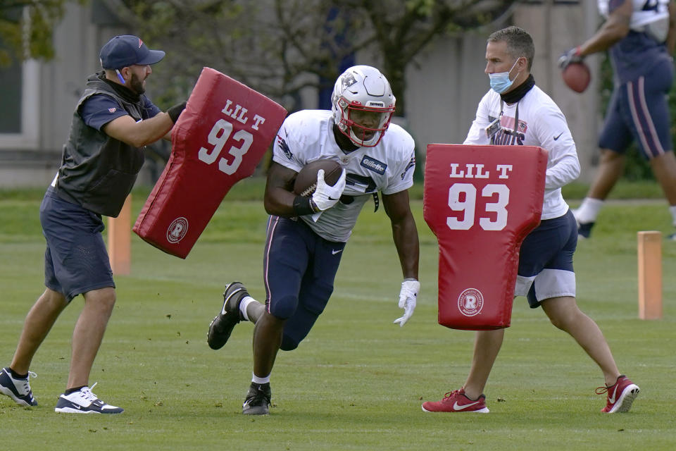 New England Patriots running back Damien Harris runs through a drill during an NFL football training camp practice, Tuesday, Aug. 25, 2020, in Foxborough, Mass. (AP Photo/Steven Senne, Pool)