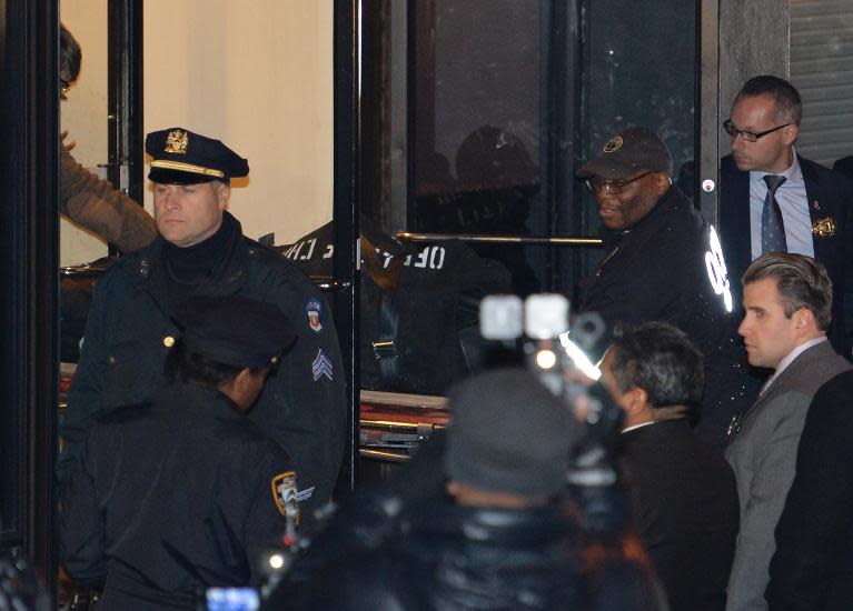 The body of US actor Philip Seymor Hoffman is removed from his apartment building after he was reported dead February 2, 2014 in the Greenwich Village area of New York