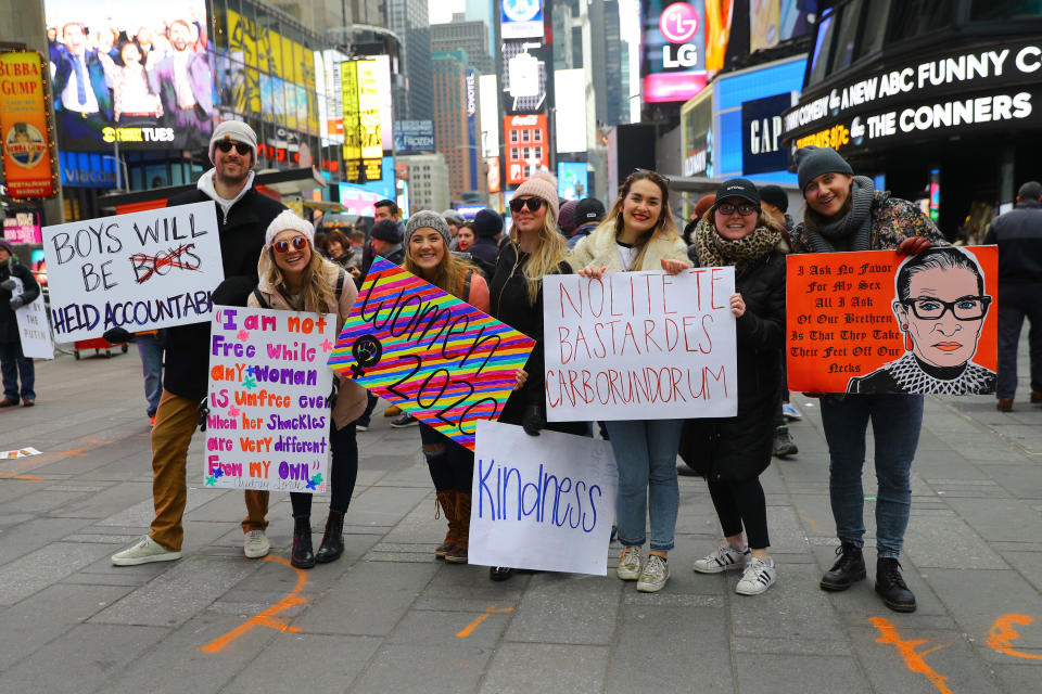 Taryn Luby (third from left) poses with friends in Times Square after the Women’s March. (Photo: Gordon Donovan/Yahoo News)