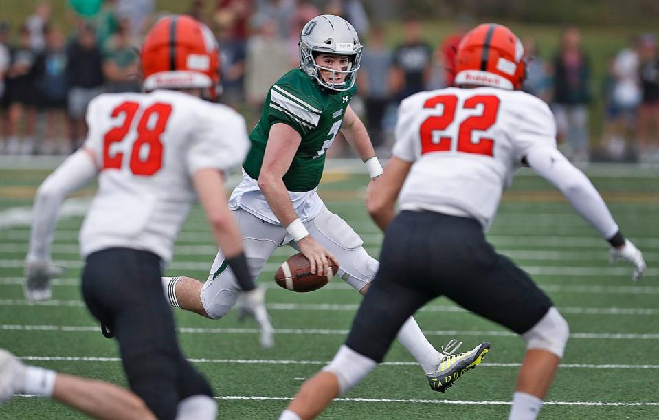 Dragons QB Matt Festa looks for a little opening in the Middleboro line.The Duxbury Dragons hosted the Middleboro Sachems in MIAA football tournament action on Friday November 11, 2022.