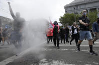 People march toward City Hall during a protest over the Memorial Day death of George Floyd, a handcuffed black man in police custody in Minneapolis, in San Francisco, Saturday, May 30, 2020. (AP Photo/Jeff Chiu)