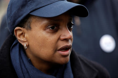 Chicago mayoral candidate Lori Lightfoot speaks to a reporter as she greets commuters at the Logan Square Blue Line station during a runoff election for mayor against Toni Preckwinkle in Chicago, Illinois, U.S., April 2, 2019. REUTERS/Joshua Lott