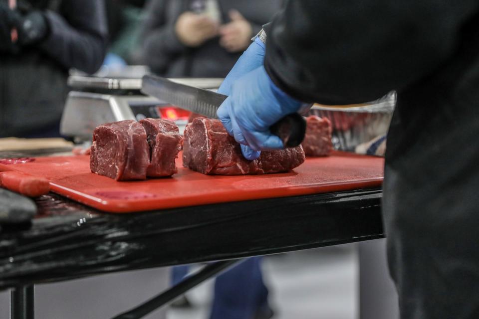 Thirty professional meat- cutters from across Michigan and Indiana compete on the ice in the first round of the Texas Roadhouse Qualifier meat cutting challenge at Big Boy Arena in Fraser, Mich. on Tuesday, Sept. 19, 2023.