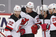 New Jersey Devils' Nolan Foote (25) celebrates his first goal of the season during the third period of an NHL hockey game against the Pittsburgh Penguins in Pittsburgh, Tuesday, April 20, 2021. (AP Photo/Gene J. Puskar)
