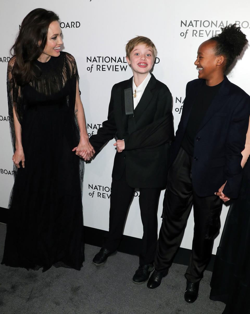 Jolie was beaming on Jan. 9, 2018, as she <a href="http://people.com/babies/angelina-jolie-attends-nyc-awards-gala-with-daughters-shiloh-zahara/" rel="nofollow noopener" target="_blank" data-ylk="slk:attended The National Board of Review Awards Gala;elm:context_link;itc:0;sec:content-canvas" class="link ">attended The National Board of Review Awards Gala</a> in New York City accompanied by her daughters Shiloh — who'd broken her arm while snowboarding and wore a black sling over a black suit — and Zahara.