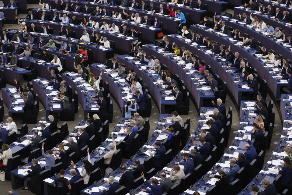 Lawmakers vote on the Artificial Intelligence act Wednesday, June 14, 2023 at the European Parliament in Strasbourg, eastern France. Authorities worldwide are racing to rein in artificial intelligence, including in the European Union, where groundbreaking legislation is set to pass a key hurdle Wednesday. European Parliament lawmakers are due to vote on the proposal — including controversial amendments on facial recognition. (AP Photo/Jean-Francois Badias)