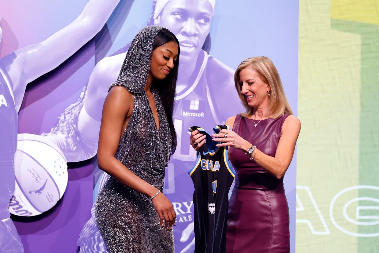 NEW YORK, NEW YORK - APRIL 15: Angel Reese celebrates with WNBA Commissioner Cathy Engelbert after being selected seventh overall pick by the Chicago Sky during the 2024 WNBA Draft at Brooklyn Academy of Music on April 15, 2024 in New York City. (Photo by Sarah Stier/Getty Images)