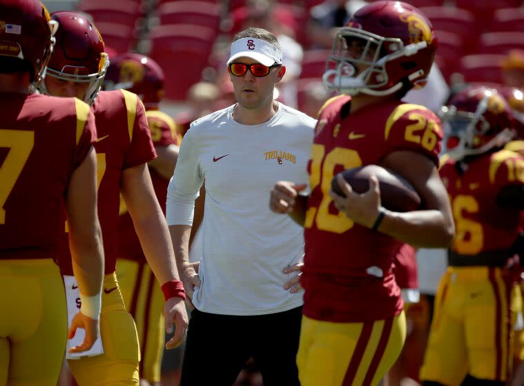 LOS ANGELES, CALIF. - SEP. 3, 2022. USC head coach Lincoln Riley watche his Trojans team warm up.