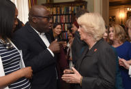 The Duchess of Cornwall speaks to Edward Enninful, editor-in-chief of British Vogue magazine during a reception at Clarence House in London to mark the beginning of the annual Women of the World (WOW) festival.