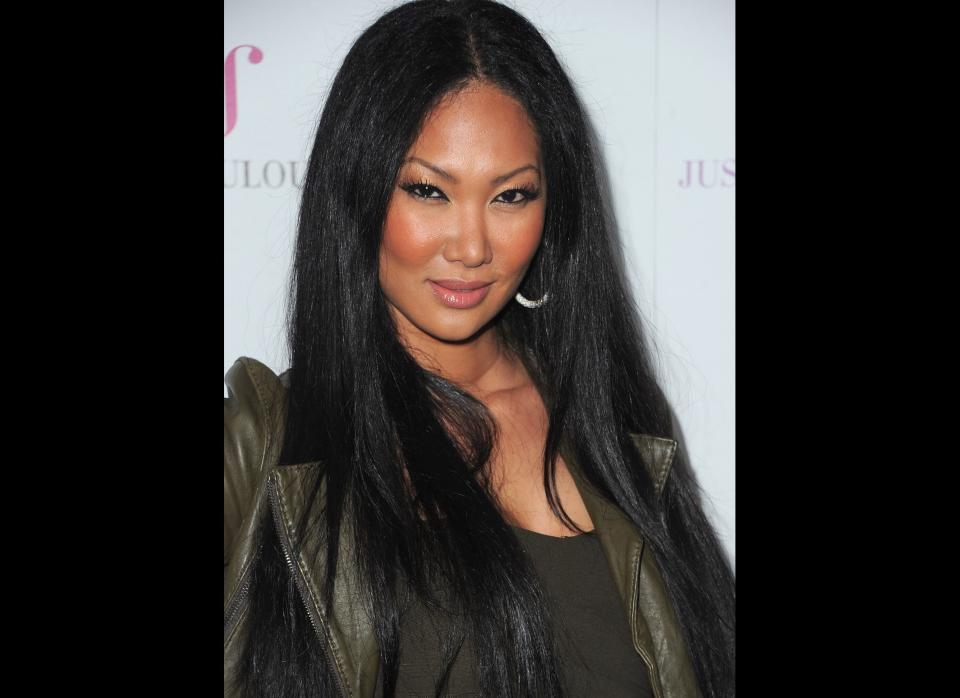 Long before her reality show career, the Baby Phat empire and her "Simmons" last name, Kimora Lee was a successful runway model. She, too, claims she was bullied by schoolmates for being tall, as she was a whopping five foot ten by the time she was 10 years old. She was also poked fun of for her half-Asian heritage and not fitting the African-American stereotype. She recalls, "All the black kids said, 'She thinks she's white!'" Now Kimora's got enough success to leave all the teasing behind. (Getty photo) 