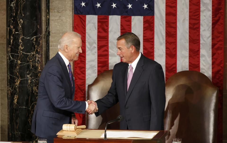 U.S. Vice President Biden shakes hands with Speaker of the House Boehner as he arrives for U.S. President Obama's State of the Union address to a joint session of the U.S. Congress on Capitol Hill in Washington