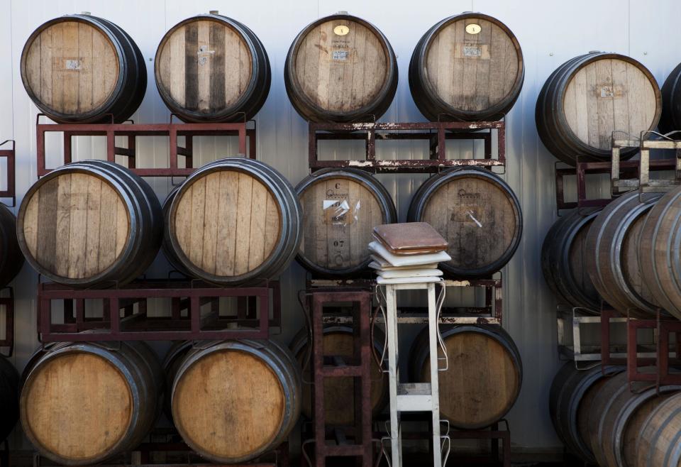 In this Tuesday, Feb. 11, 2014 photo, barrels are seen in an Israeli winery in the West Bank settlement of Psagot. With Israel mired in a struggle to combat growing calls in Europe to boycott Israeli products and businesses with ties to the settlements, a quieter, subtler and more informal campaign is taking place at home among Israelis themselves. The Palestinians complain that the growing settler population makes it ever more difficult to partition the land. The issue has taken center stage in ongoing U.S.-mediated peace talks. (AP Photo/Dan Balilty)