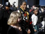 <p>Myrlie Evers, center, civil rights activist and widow of civil rights leader Medgar Evers, is escorted to the entrance of the two museums, the Museum of Mississippi History and the Mississippi Civil Rights Museum, Saturday, Dec. 9, 2017, in Jackson, Miss., following opening ceremonies. (Photo: Rogelio V. Solis/AP) </p>