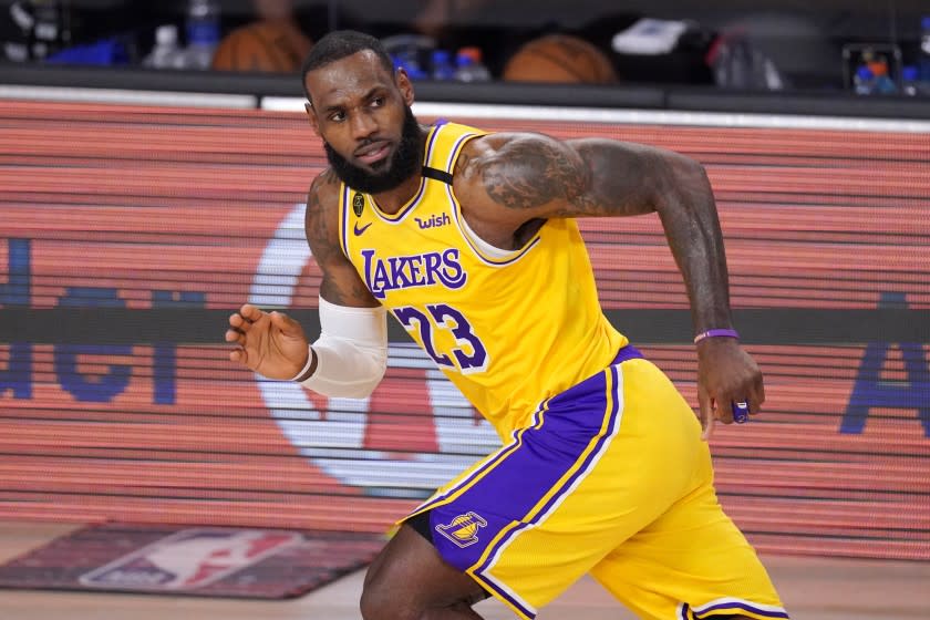 Los Angeles Lakers' LeBron James (23) plays against the Denver Nuggets during the first half.