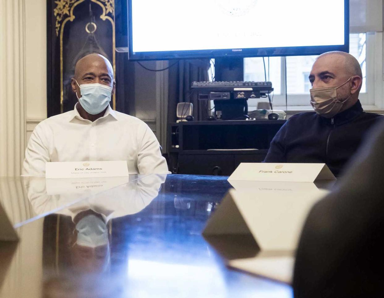 New York City Mayor Adams (left) holds a cabinet meeting at City Hall in Manhattan, New York on Saturday, Jan. 1, 2022. Pictured at the right is Frank Carone.