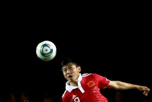 China stormed into the third round of the 2014 World Cup qualifiers on Thursday as they smashed six past hapless Laos to claim a 13-3 aggregate victory. Laos went into the match in Vientiane trailing 7-2 after the first leg and there was no let-up from the visitors as Qu Bo opened the scoring after 24 minutes before Yu Hanchao, pictured in June 2011, put China two up at half-time