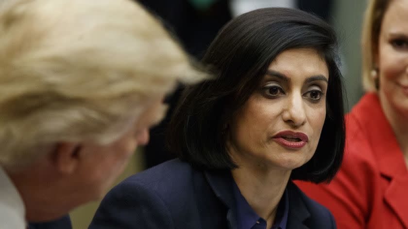 FILE - In this March 22, 2017, file photo President Donald Trump , left, and Texas State Sen. Dawn Buckingham, right, listen as Administrator of the Centers for Medicare and Medicaid Services Seema Verma speaks during a meeting on women in healthcare in the Roosevelt Room of the White House in Washington. Verma is slamming â€˜Medicare for All,â€™ the proposal from Vermont Democratic Sen. Bernie Sanders for a national health care plan that would cover all Americans. (AP Photo/Evan Vucci, File)