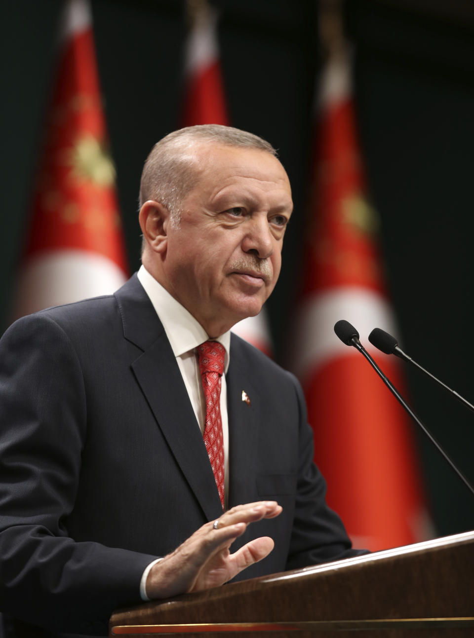 Turkey's President Recep Tayyip Erdogan speaks after a cabinet meeting, in Ankara Turkey, Monday, Aug. 10, 2020. The government of Greece slammed Turkey's announcement that it will be conducting energy exploration in an area of the eastern Mediterranean that Athens says overlaps its continental shelf, as tension over the rights to natural resources increased sharply in the region Monday.(Turkish Presidency via AP, Pool)