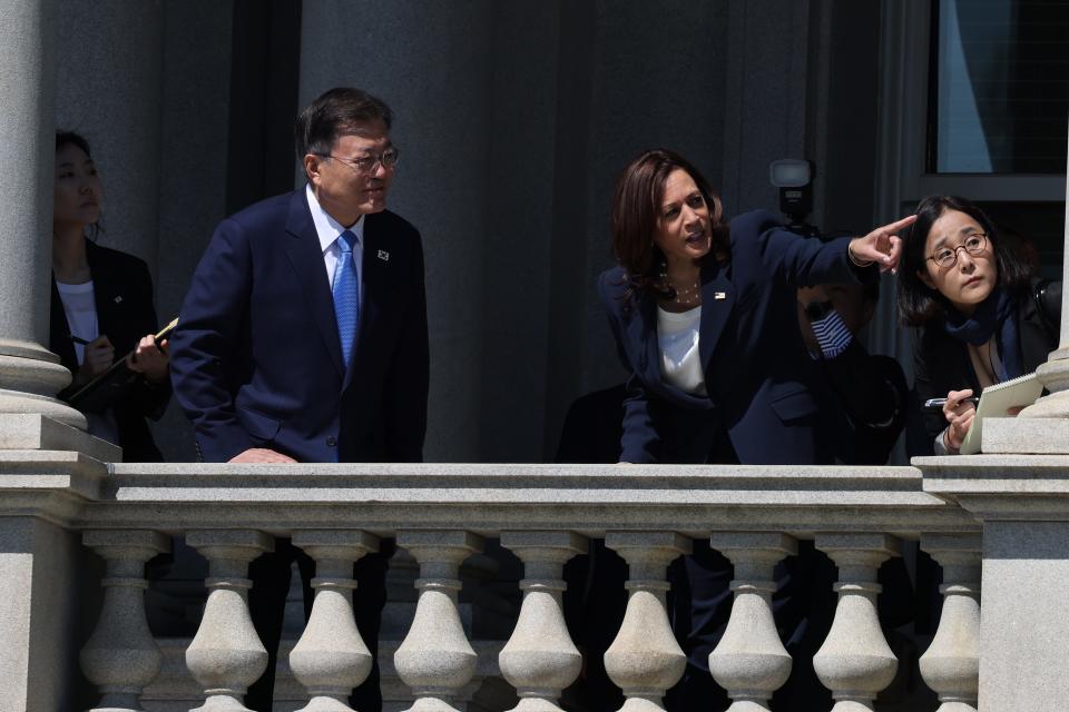 U.S. Vice President Kamala Harris and Korean President Moon Jae-in look at the White House from a balcony of the Eisenhower Executive Office Building on May 21, 2021 in Washington, DC.