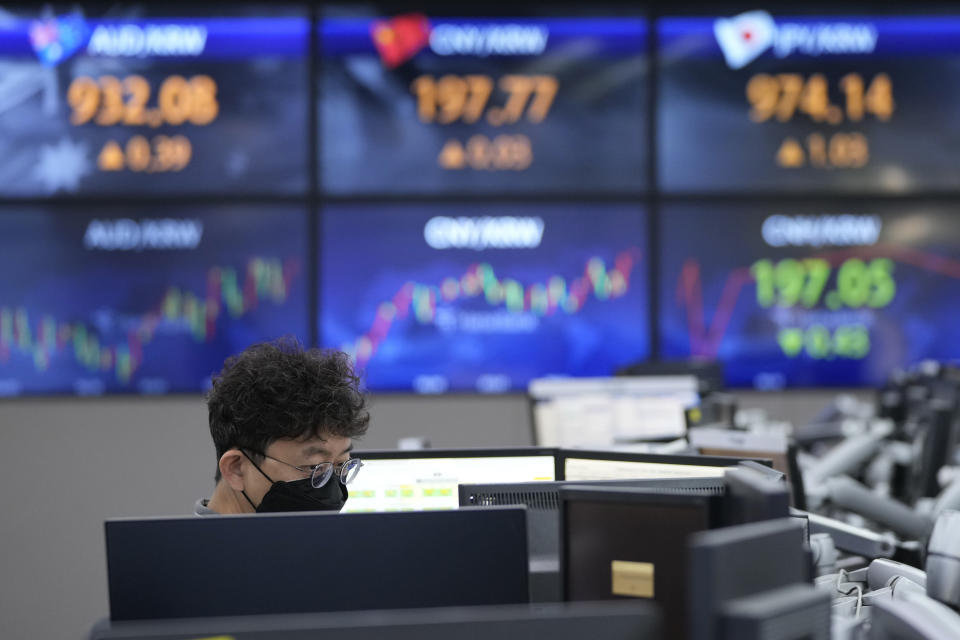 A currency trader watches monitors at the foreign exchange dealing room of the KEB Hana Bank headquarters in Seoul, South Korea, Tuesday, Sept. 6, 2022. (AP Photo/Ahn Young-joon)