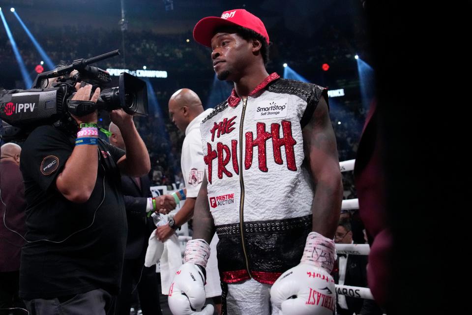 Errol Spence Jr arrives in the ring at the T-Mobile Arena (AP)