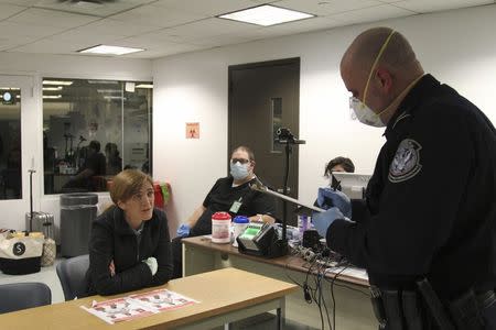 U.S. Ambassador to the United Nations Samantha Power answers questions from Customs and Border Protection officers at John F. Kennedy airport in New York, October 30, 2014. REUTERS/Michelle Nichols