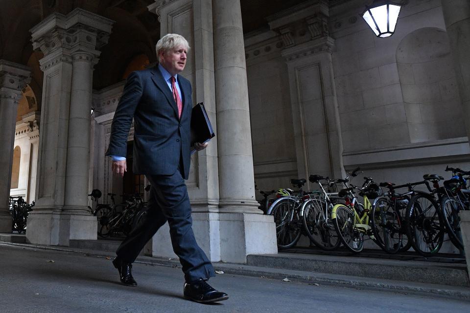 Britain's Prime Minister Boris Johnson walks to Downing Street in central London on September 22, 2020 after attending the weekly meeting of the cabinet at the Foreign, Commonwealth and Development Office (FCDO). - The UK government will on Tuesday announce new measures to curb rising coronavirus cases across England, hours after upgrading the virus alert level with top advisers warning of a surging death toll within two months without immediate action. (Photo by JUSTIN TALLIS / AFP) (Photo by JUSTIN TALLIS/AFP via Getty Images)