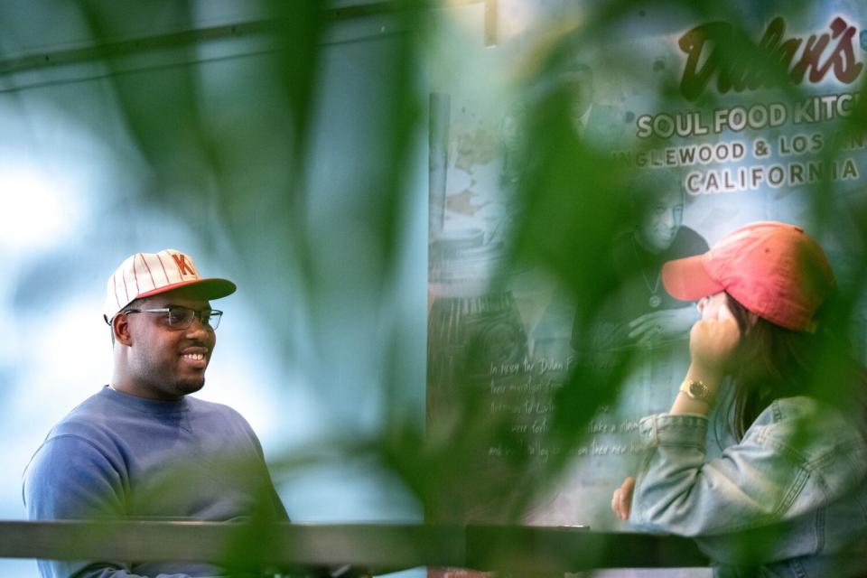 Lionel Boyce and Los Angeles Times food columnist Jenn Harris sit outside and talk.