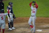 New York Yankees catcher Gary Sanchez, second from right, watches as Washington Nationals' Juan Soto (22) gestures as he reaches home plate after hitting a two-run home run of a baseball game Friday, May 7, 2021, in New York. (AP Photo/Frank Franklin II)