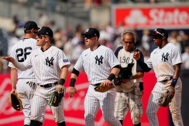 New York Yankees' Kyle Higashioka drops his bat after making