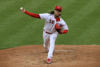 Cincinnati Reds' Luis Castillo throws during the first inning of the team's baseball game against the Arizona Diamondbacks in Cincinnati, Tuesday, April 20, 2021. (AP Photo/Aaron Doster)