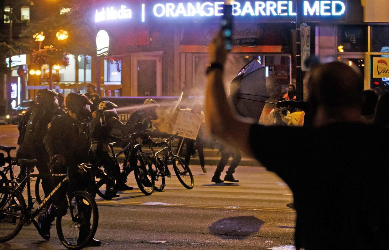 Columbus police officers used pepper spray to disperse protesters following the death of George Floyd last May.